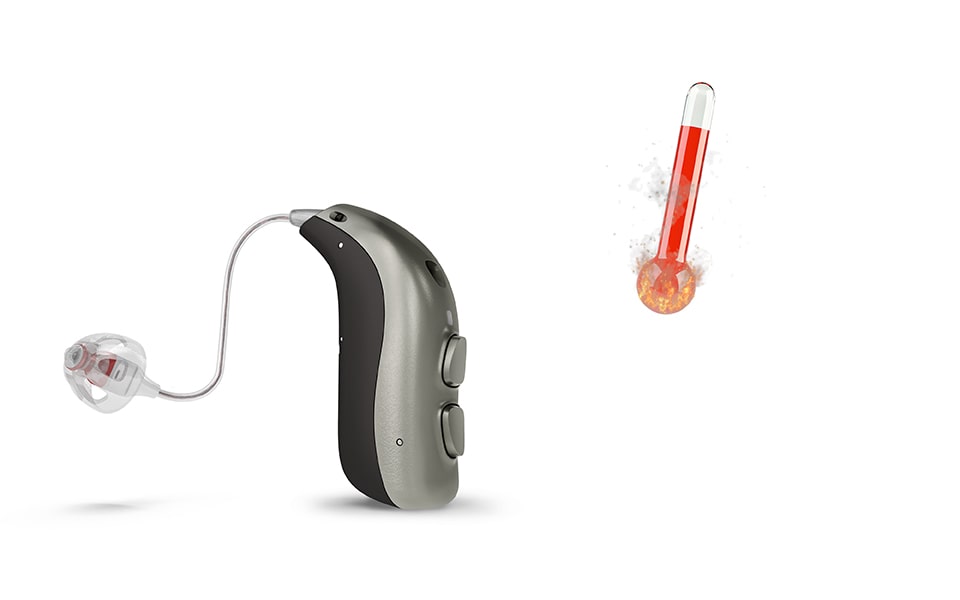 Une aide auditive Bernafon minirite à côté d'un thermomètre dont la barre rouge indique une température élevée.