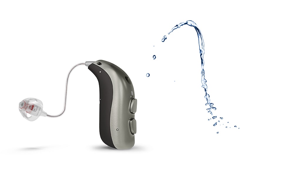 Bernafon behind the ear hearing aid next to splash of water