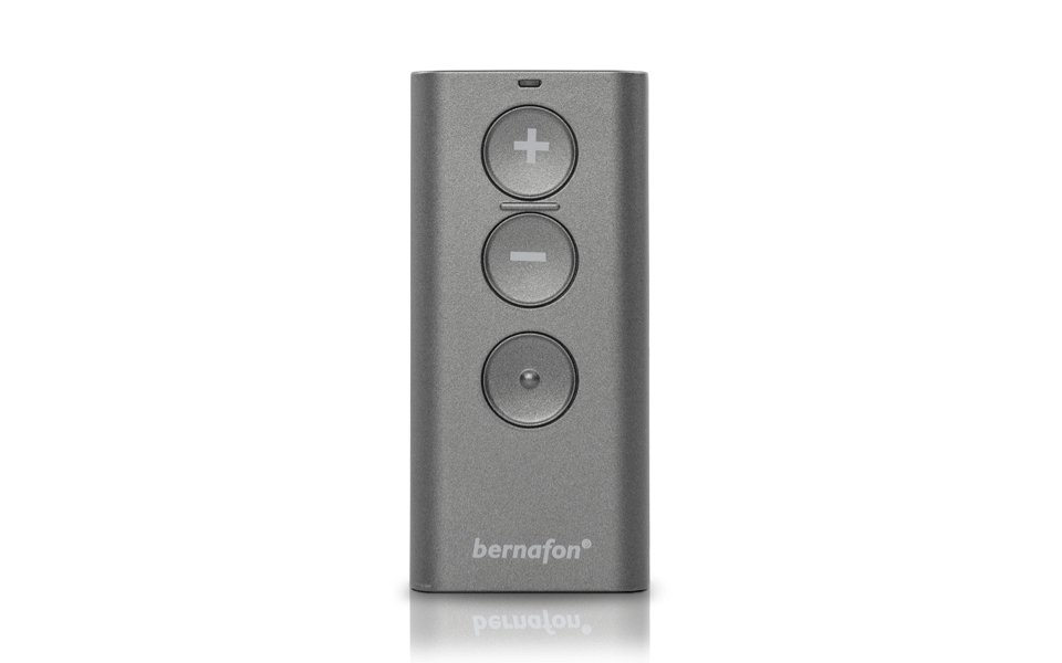 Picture of the easy to use Bernafon remote control with three buttons for hearing aid volume control and program changes